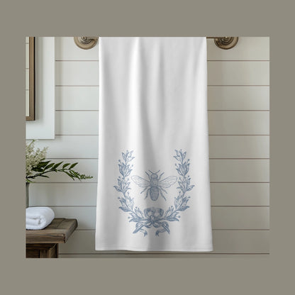 Shower curtain with bee and laurel wreath design in a bathroom setting