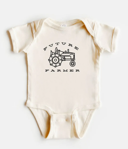 Baby onesie with 'Future Farmer' and tractor design on a white background