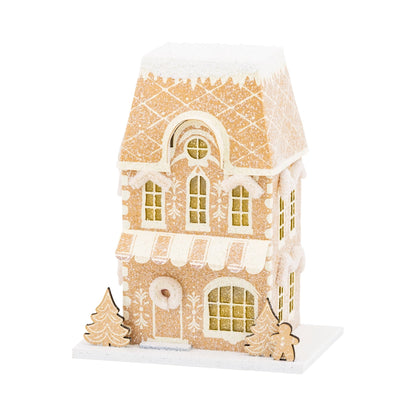 Gingerbread house with decorative elements on a white background