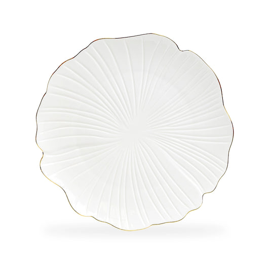 White decorative plate with gold rim on a white background