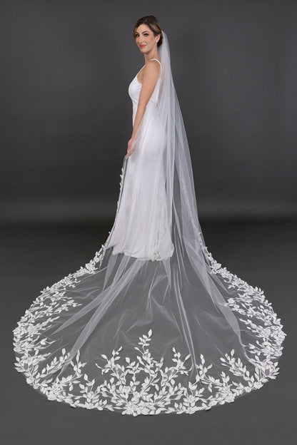 Bridal gown with a long, elegant veil on a dark background