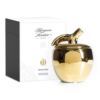 Gold candle with decorative lid and 'Thompson & Ferrier' packaging on a white background