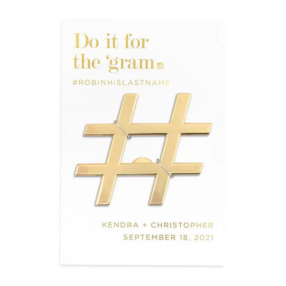 Gold hashtag charm with text on a white background