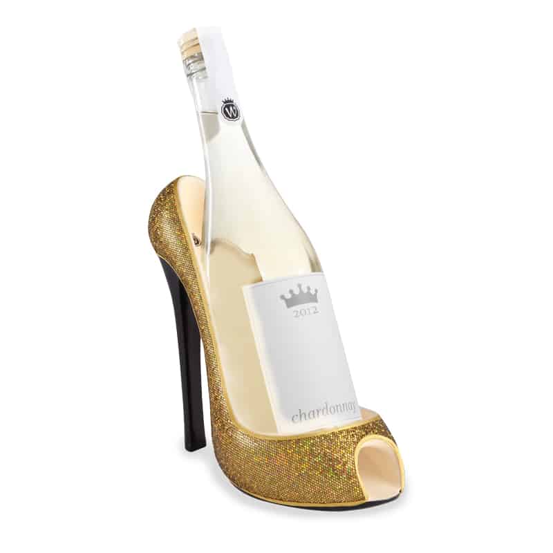 A novelty high-heeled shoe designed to look like a champagne bottle, featuring a sparkling gold glitter platform and heel, a clear back panel showing the champagne bottle inside, and a black stiletto heel.