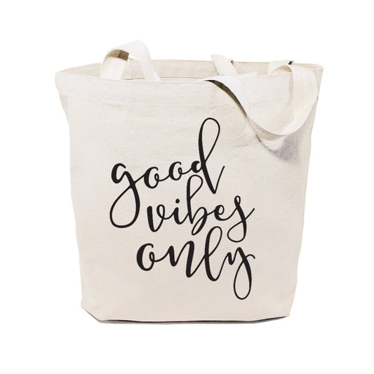 Beige tote bag with 'good vibes only' text on a white background