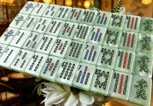 Shop the Green Pearl Traditional American Mahjong Tile Set featuring luminous pearlescent green tiles and classic-inspired designs. A beautiful gift for Mahjong players.