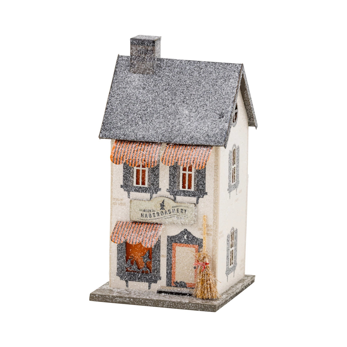 Decorative model of a house with a sign on a white background