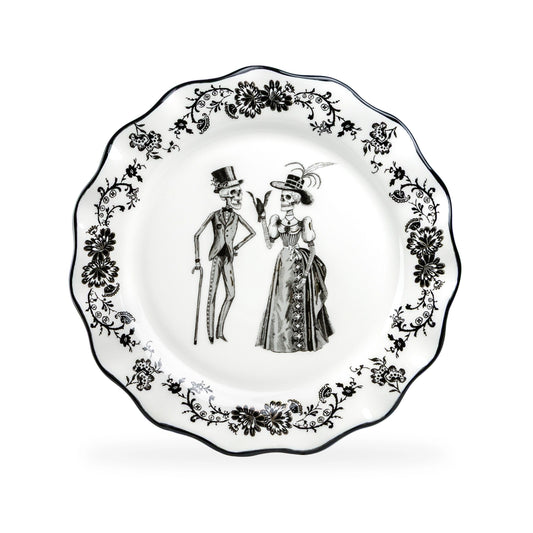 Decorative plate with skeleton couple design on a white background