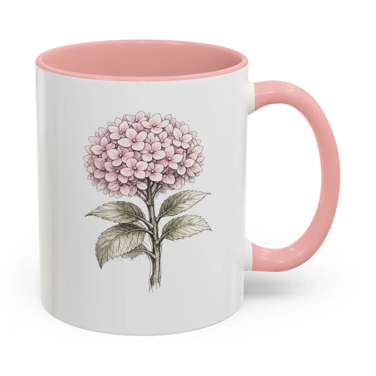 A white ceramic mug with a pink interior, pink handle, and a detailed botanical illustration of a pink hydrangea on the front, set against a plain white background.