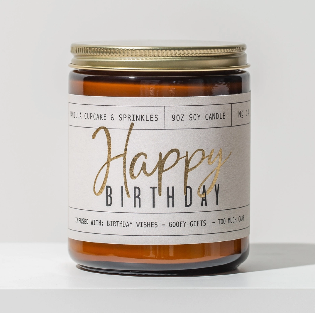 Candle jar with 'Happy Birthday' label on a white background