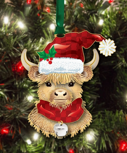 Christmas ornament of a Highland cow wearing a Santa hat on a decorated tree.