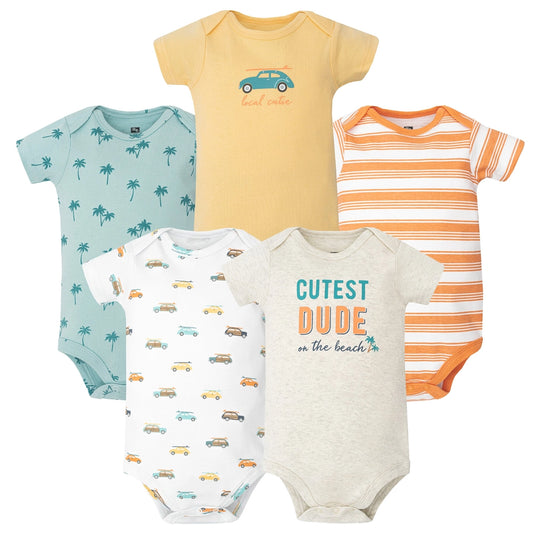 Five baby bodysuits with different designs on a white background