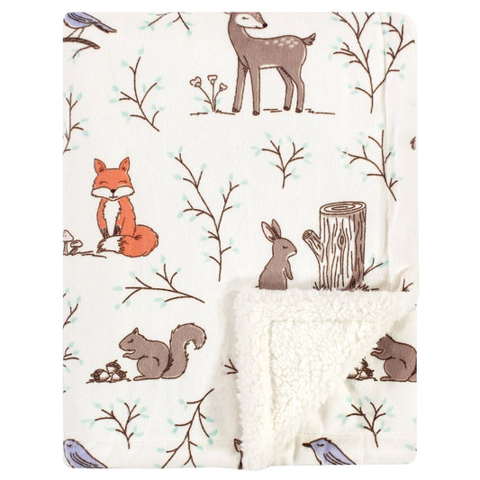 Flannel fabric with forest animal pattern featuring fox, deer, rabbit, and squirrel on a white background.