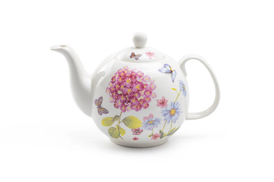 Teapot with floral design on a white background