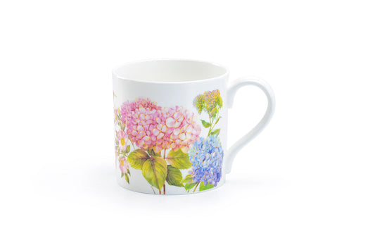 White mug with floral design on a white background