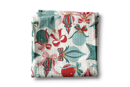 Waffle-textured towel with festive pattern on a white background