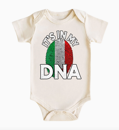 Natural cream Italian baby bodysuit featuring It's in My DNA lettering and a fingerprint illustration in green, white, and red Italian flag colors.