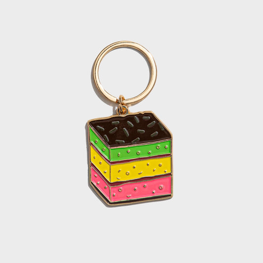 Colorful cake-shaped keychain on a white background