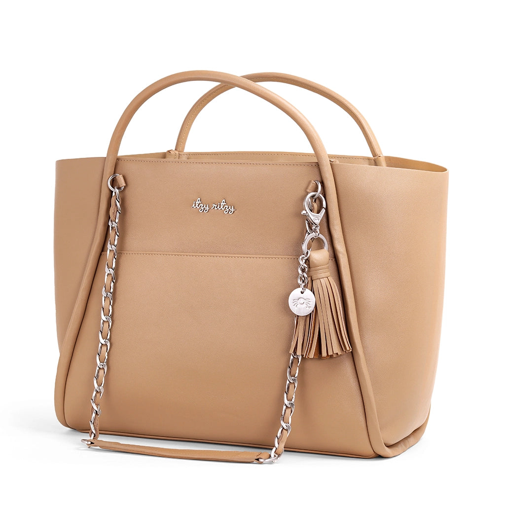 Beige handbag with chain detail and tassel on a white background