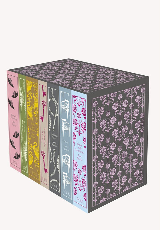 Set of six books with decorative covers on a white background