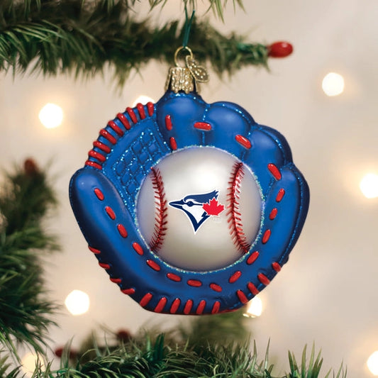 Baseball glove ornament with a baseball inside, featuring a logo, on a Christmas tree.