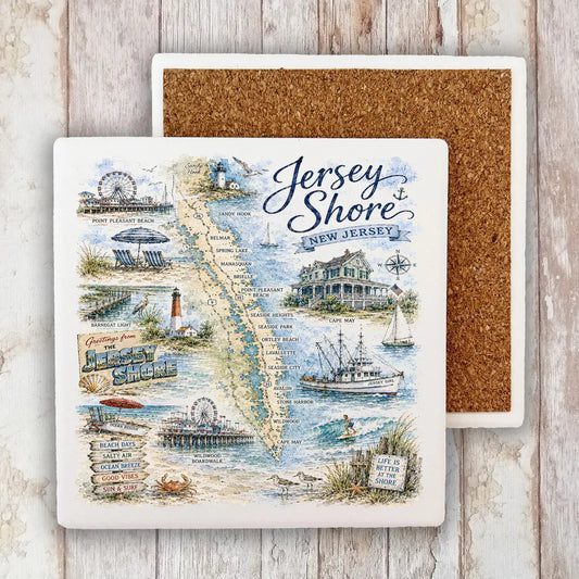 A square ceramic coaster featuring a vintage-style illustrated map of Jersey Shore, New Jersey, with beach scenes, boats, and text, shown in front of a second coaster with a brown cork backing on a whitewashed wood surface.