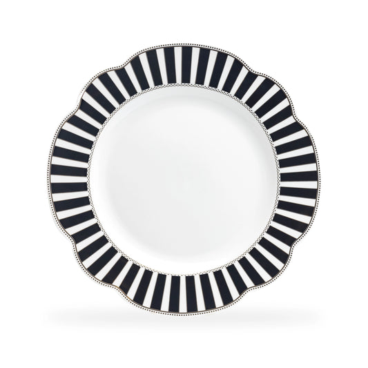 Decorative plate with black and white striped rim on a white background