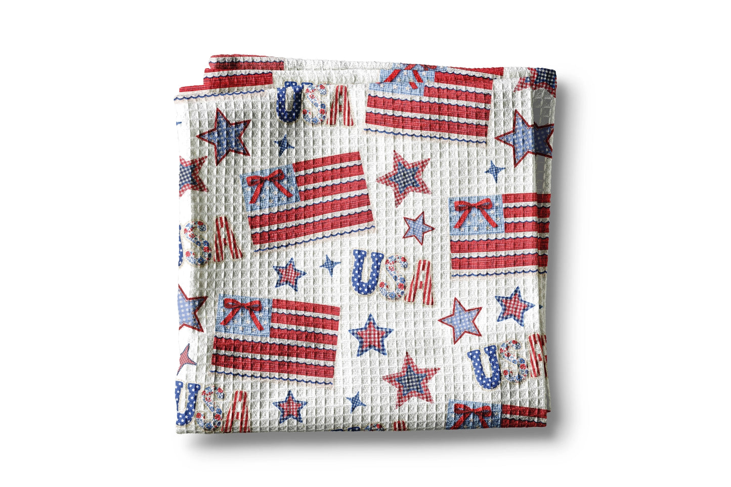 Folded fabric with American flag and 'USA' pattern on a white background