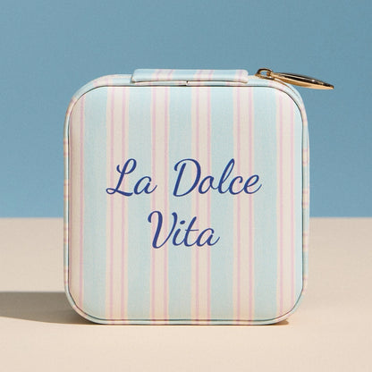 Striped case with 'La Dolce Vita' text on a blue and beige background