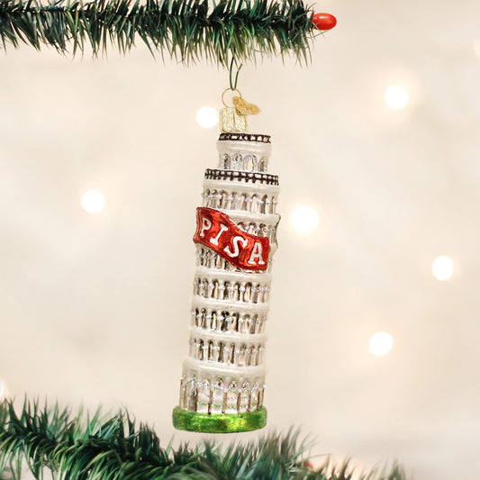Leaning Tower of Pisa Christmas ornament hanging on a tree with lights in the background
