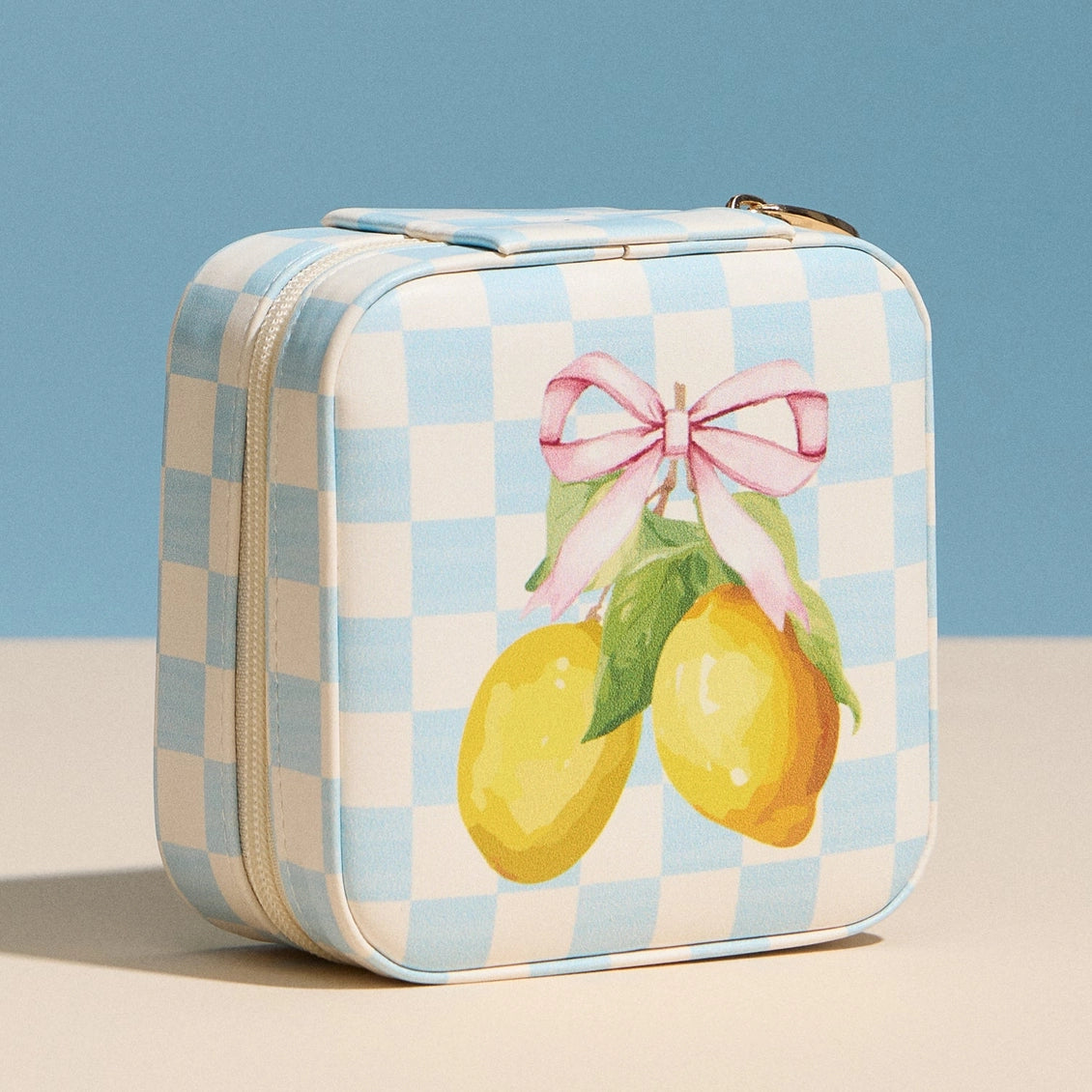 Rectangular tin with lemon design and checkered pattern on a blue background