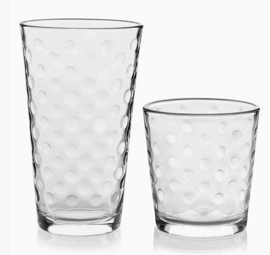 Two clear glass tumblers with textured design on a white background