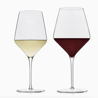 Two wine glasses, one with white wine and the other with red wine, on a white background.