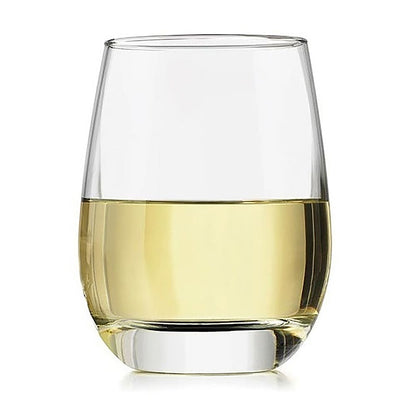 Clear glass filled with white wine on a white background