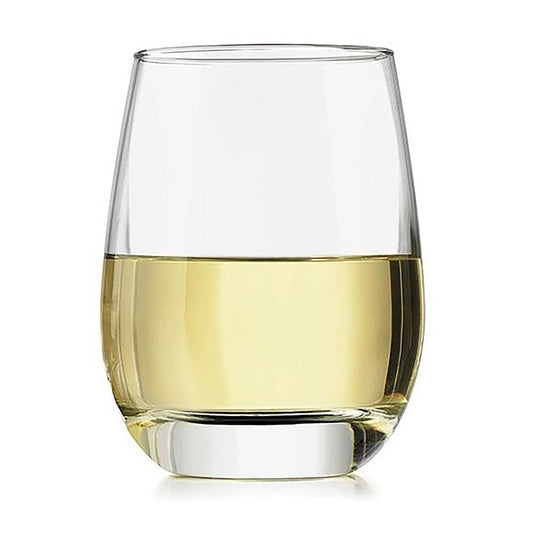 Clear glass filled with white wine on a white background