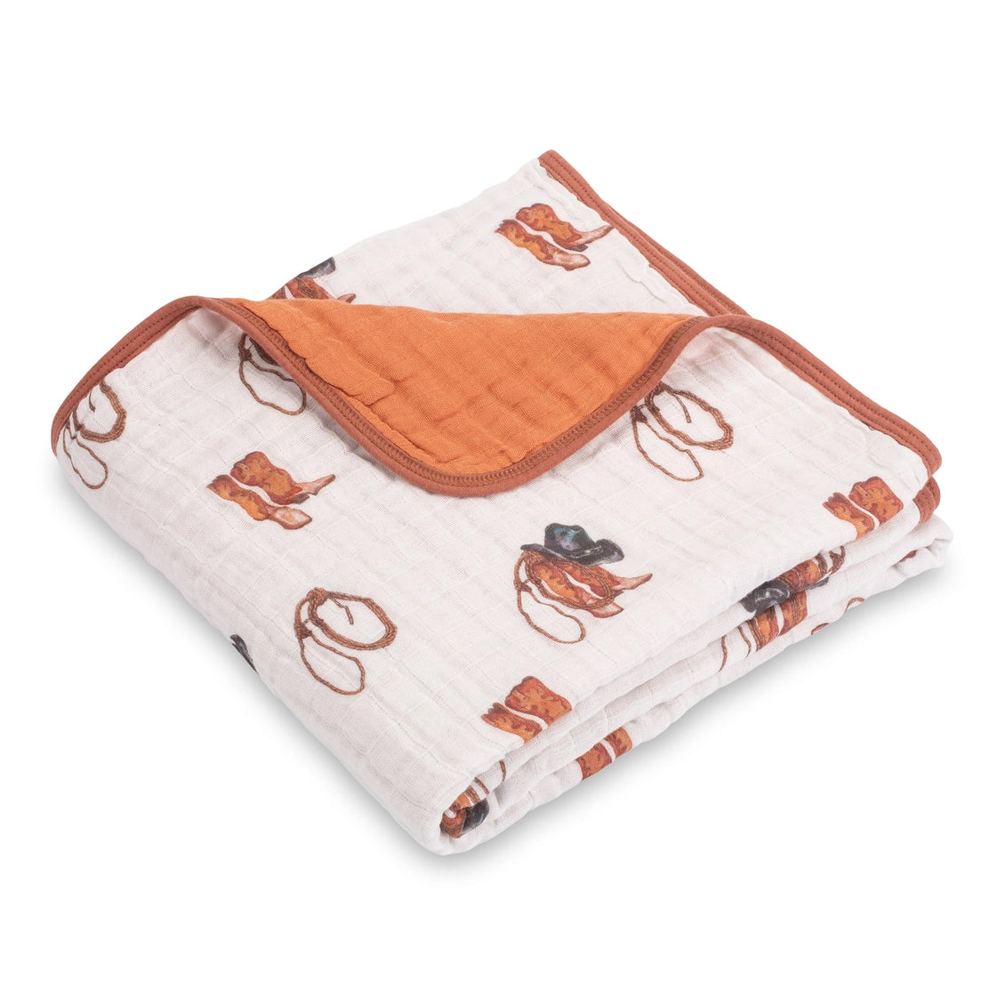 Folded baby blanket with orange and white pattern on a white background