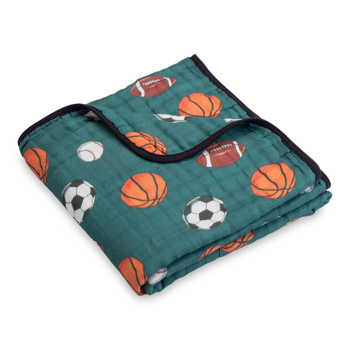 Folded blanket with sports ball pattern on a white background