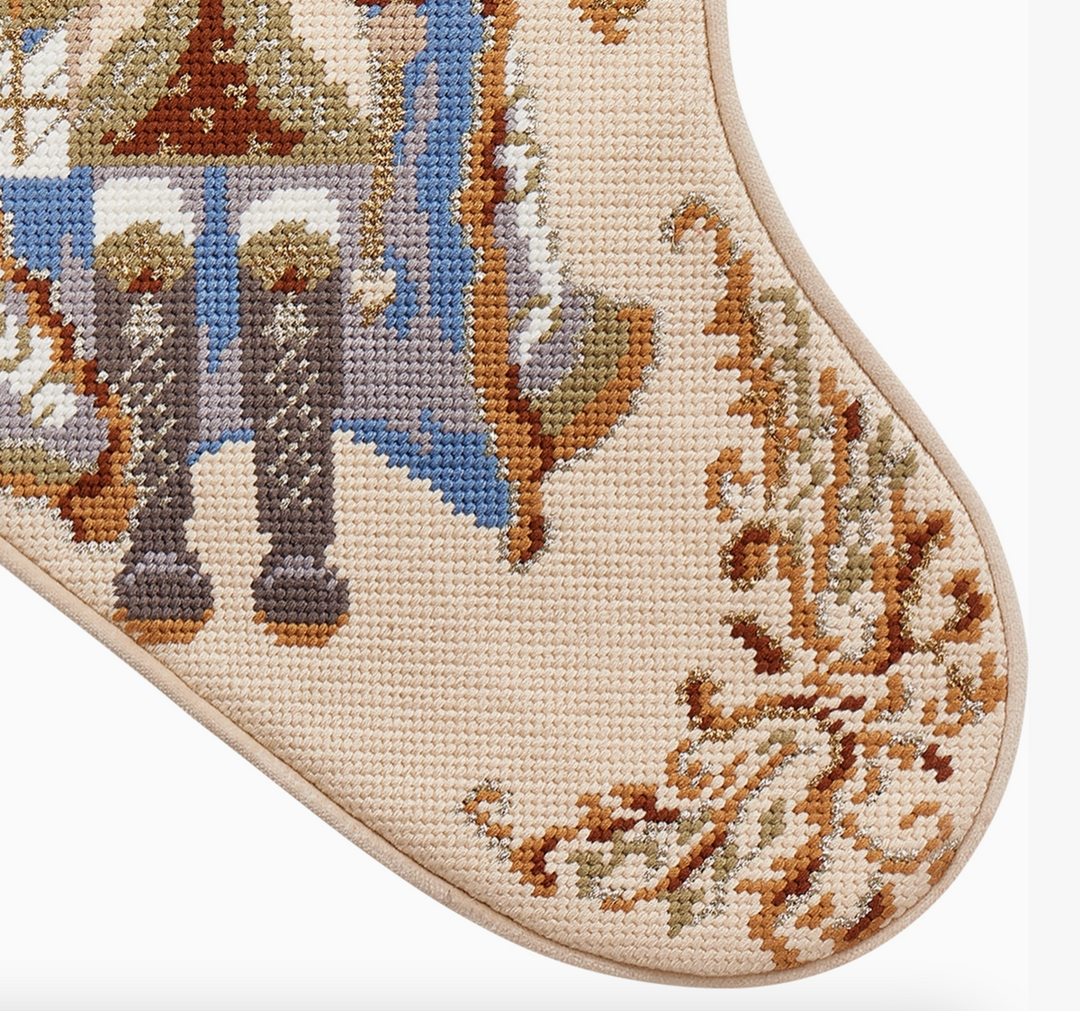 Close-up of Nutcracker Ivory Needlepoint Christmas Stocking showing detailed wool needlepoint stitching, nutcracker uniform and ornamental scrollwork