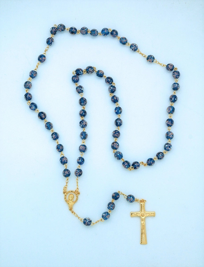 Blue rosary with gold accents on a light blue background