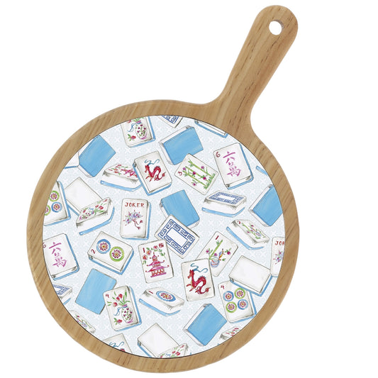 Round wooden cutting board with Mahjong tile pattern on a white background