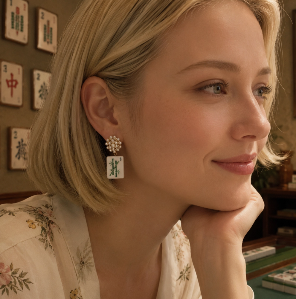 Woman wearing Ellison + Young Jade Bamboo Mahjong Tile Pearl Cluster Drop Earring with faux pearl post and green bamboo tile charm.