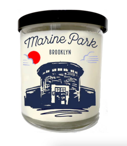 Candle with 'Marine Park Brooklyn' label on a white background