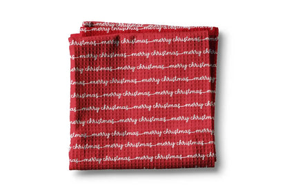 Red towel with 'merry christmas' text on a white background