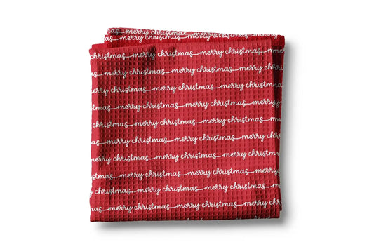 Red towel with 'merry christmas' text on a white background