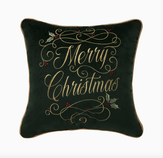 Deep green Merry Christmas throw pillow with gold embroidered script, holly leaves, red berries and gold piping
