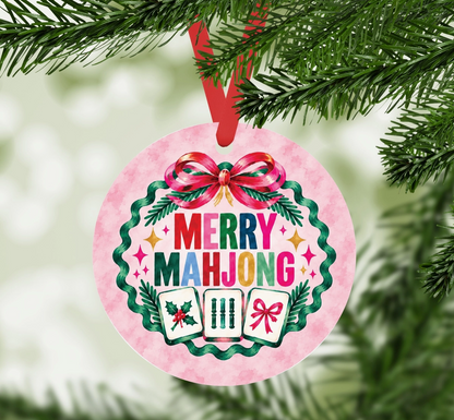 Merry Mahjong round aluminum Christmas ornament hanging from a Christmas tree with red ribbon