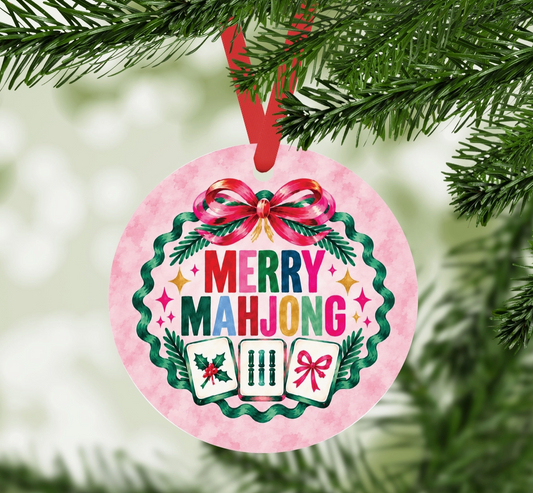 Merry Mahjong round aluminum Christmas ornament hanging from a Christmas tree with red ribbon