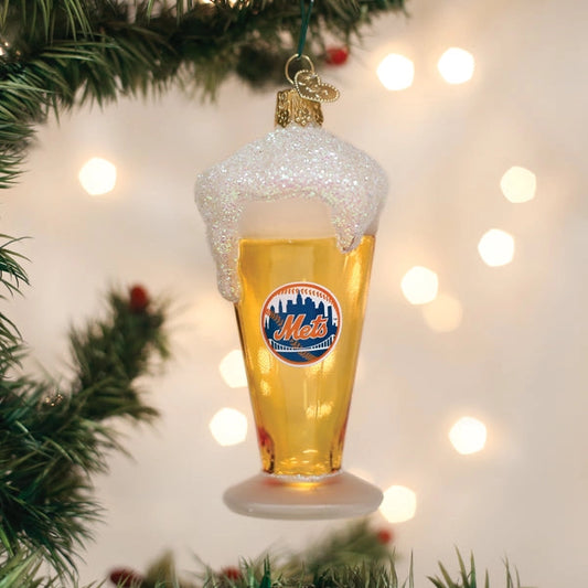 Christmas ornament shaped like a beer glass with foam, featuring a logo, on a decorated Christmas tree.