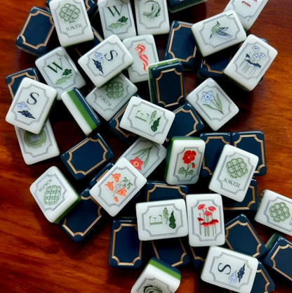 Midnight Blue Botanical American Mahjong tiles with ivory floral faces, navy blue backs and elegant gold decorative borders