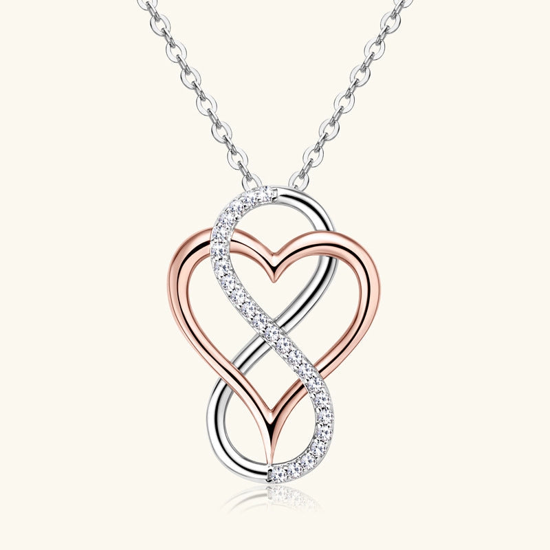 Jewelry necklace with a heart and infinity symbol pendant on a white background